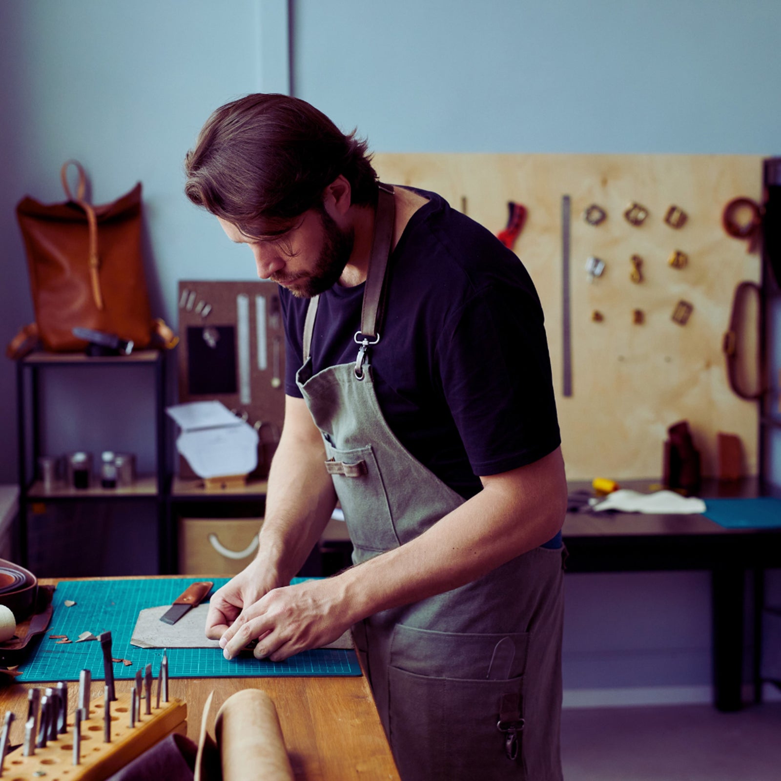 Leather worker by toe beans
