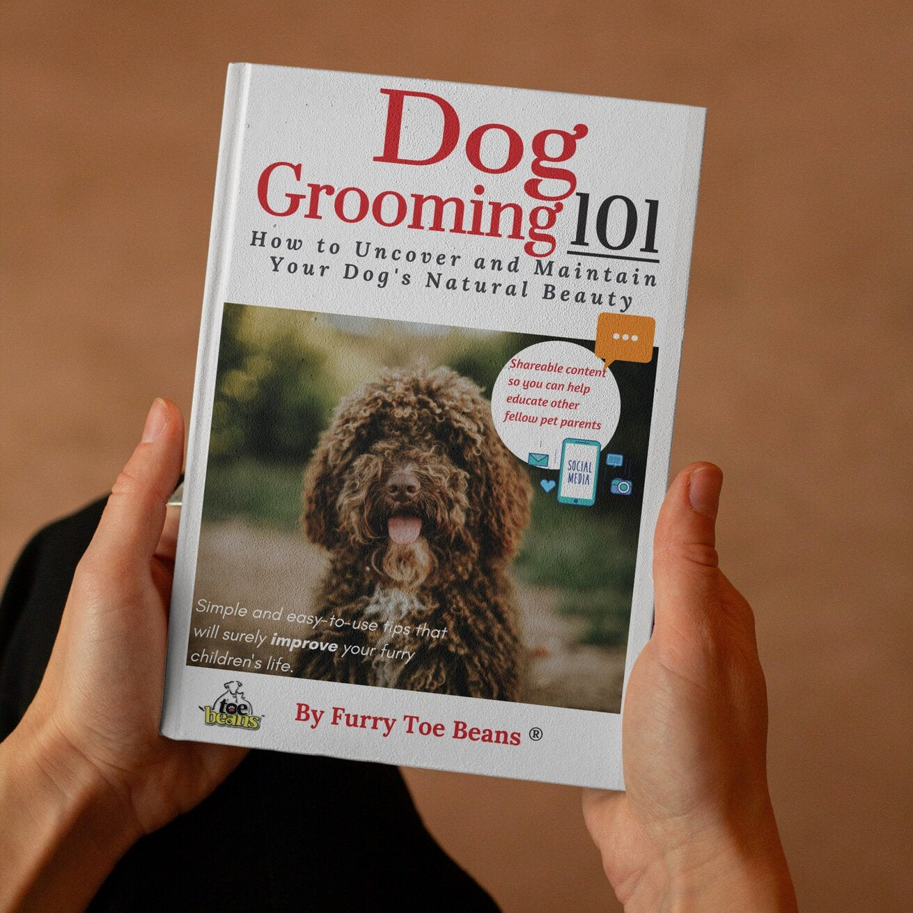 Person Holding Dog Grooming 101 dog Book by toe Beans®