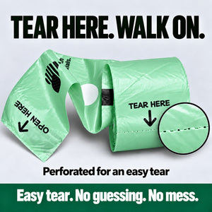 Close up of Better Walks dog bags on a roll with a magnified perforation line and instructions for an easy tear.