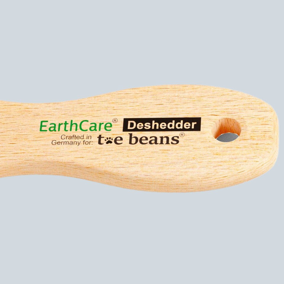 Handle of Dog Bristle brush EarthCare Deshedder by toe beans