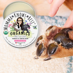 Dog Paw being moisturized with Momma KNows Best Dog Paw Balm Vegan